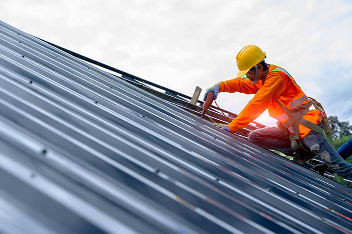 Man on a roof working